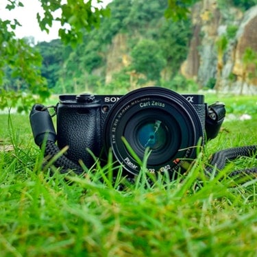 dslr camera on grass