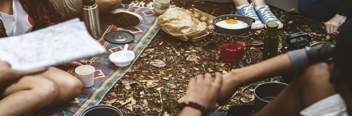 updated group of people eating on their camping area