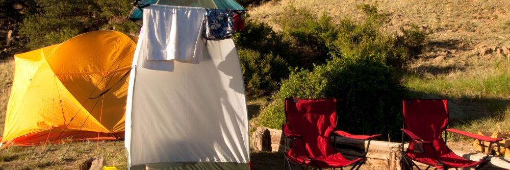 outdoor camping shower beside tent