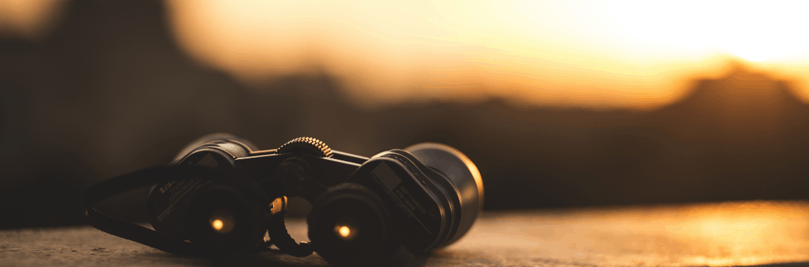 binoculars-on-surface-sunset