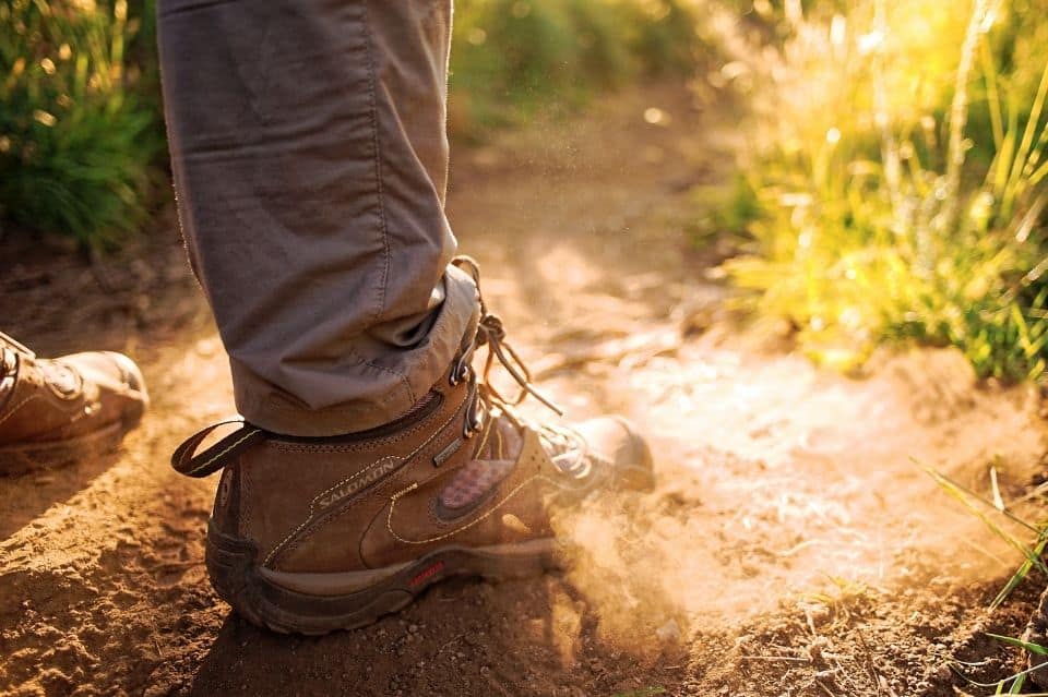 man-with-hiking-boots-on-trail